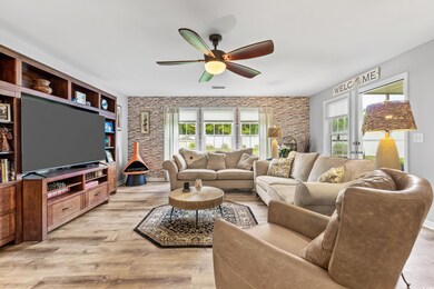 Living room featuring built in features, a healthy
