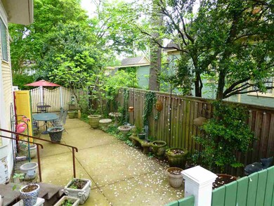 Front porch overlooks this charming side patio are