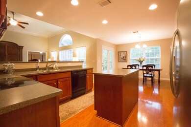 Kitchen has corian counters and hardwoods