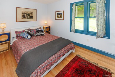 Bedroom with light wood-style floors