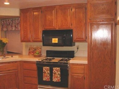LOVELY CABINETS AND CEILING HAS POT LIGHTS.