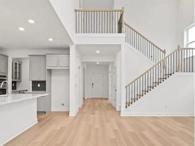 Kitchen with recessed lighting, light wood-style f