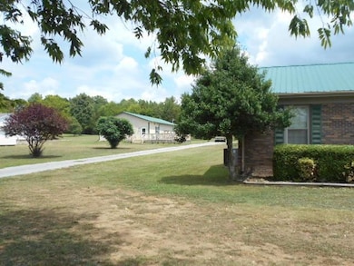 Guest house, seen on the left behind the main home