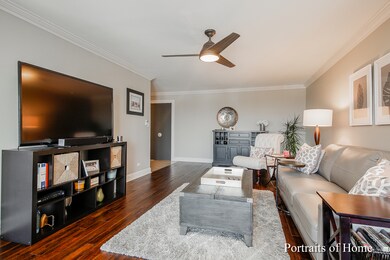 Spacious living room, with, Hardwood floors, crown