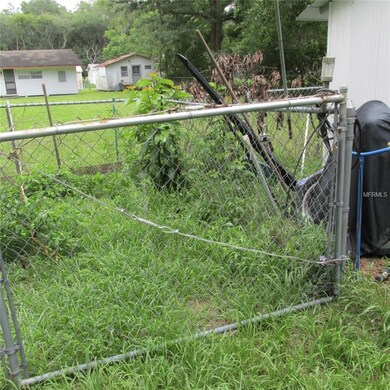 Back and sides of home are chain-link fenced in.