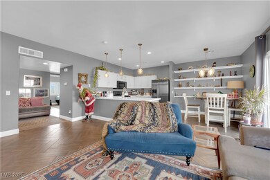 Living area featuring baseboards and recessed ligh