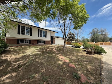 View of front of property featuring brick siding and an attached garage