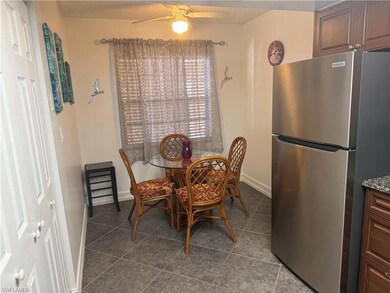 Kitchen featuring dishwasher, range, refrigerator, and glass insert cabinets