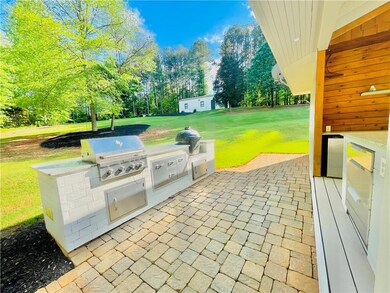 View of patio featuring view of wooded area