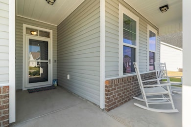 Doorway to property with covered porch
