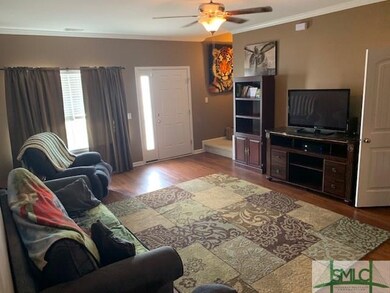 Living room features vinyl flooring and powder roo