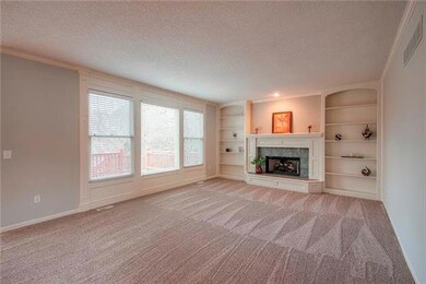 Nice size family room with gas insert log fireplac