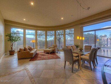 Liv & Dining Rm w/Curved Wall of Windows
