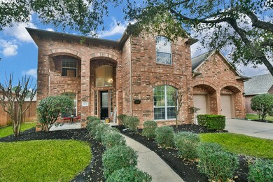 This charming two-story brick home features a welc