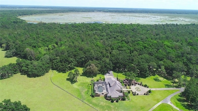 Aerial showing house and lake