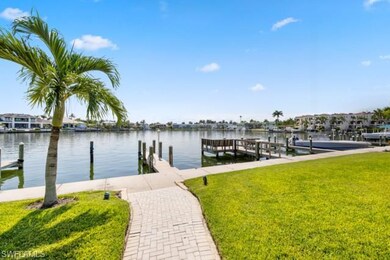 Dock area featuring a yard and a water view