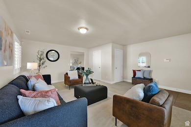 Front room view of  arched walkway into family room