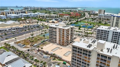 View of urban area featuring a pool area and Gulf of America - Virtually Edited Image