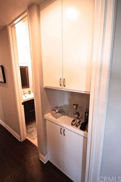 Double linen closet with display case.