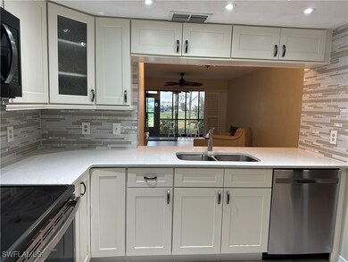 Kitchen featuring decorative backsplash, electric