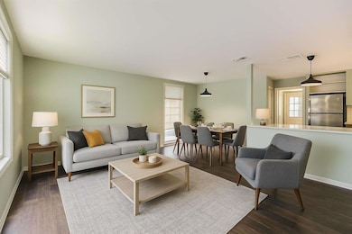 Living room featuring dark wood-style flooring