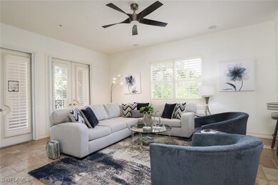Living room featuring stone tile floors, a ceiling