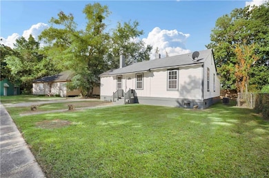 View of front of home featuring crawl space and a front yard