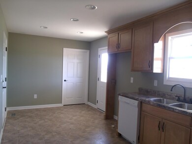 Breakfast nook with door leading out to the covered deck. Great for grilling and entertaining.