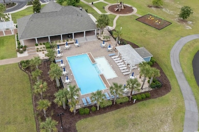 View of subject property with a pool area