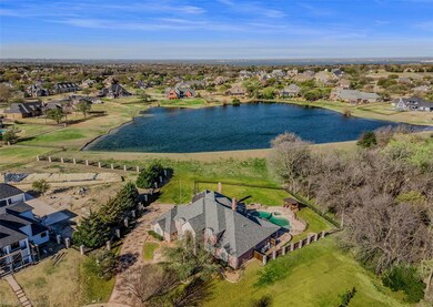 Drone / aerial view featuring a water view and a r
