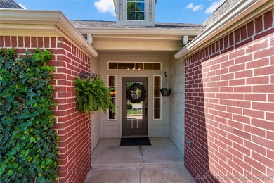 Step through a charming brick-lined path framed wi