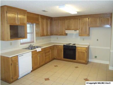 The eat in kitchen has plenty of counter space and a pantry