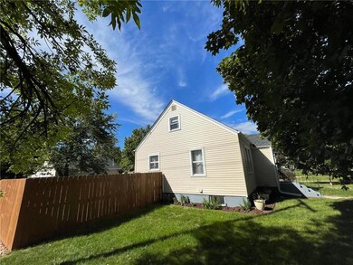 Wood privacy fence surrounding a spacious back yar