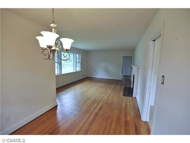 Living Room - Large living room with refinished hardwood floors.