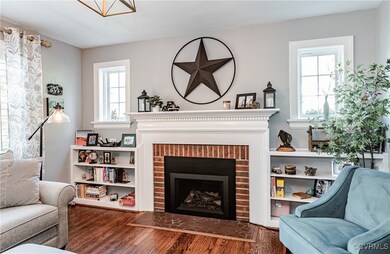 Brick fireplace with recent gas log insert