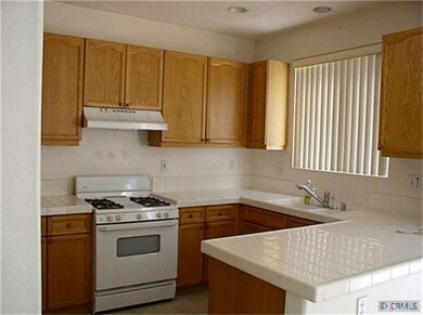 Bright Modern Kitchen with Tile Floor & G.E. Appli
