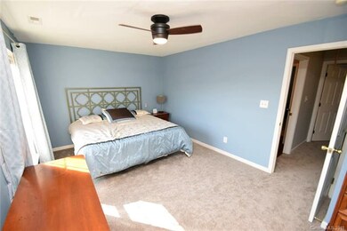 Huge bedroom with lots of windows and new carpet
