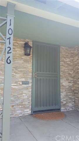 Front porch has floor to ceiling flagstone in sand
