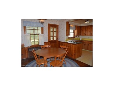 View of the kitchen with dining area with door lea