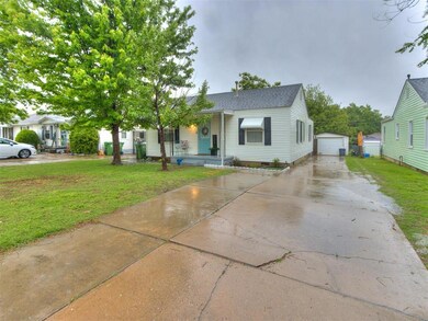 View of front of home with a porch, a front lawn, 