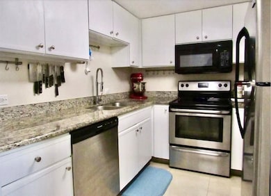Updated kitchen with stainless steel appliances. P