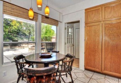 Breakfast nook looks out on beautiful back yard.