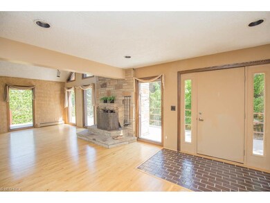 Great Room with wood flooring, entry to the expans