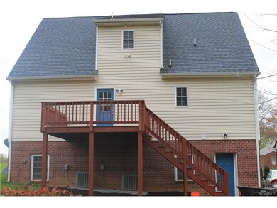 Rear Deck with Entrance into Over Sized Garage