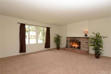 Living room has fireplace with a gas starter.