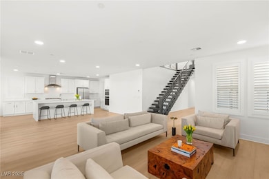 Living room with light wood-style flooring, recess