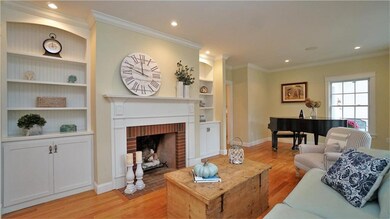 Gorgeous custom built-ins flank the...