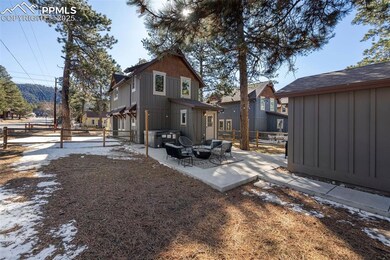 Rear view of property featuring a patio and an outdoor hangout area