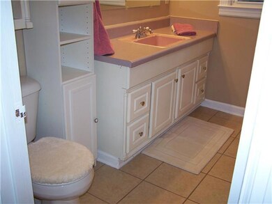 Bath with tile floors.