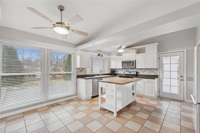 Eat-in kitchen with lots of natural light, granite